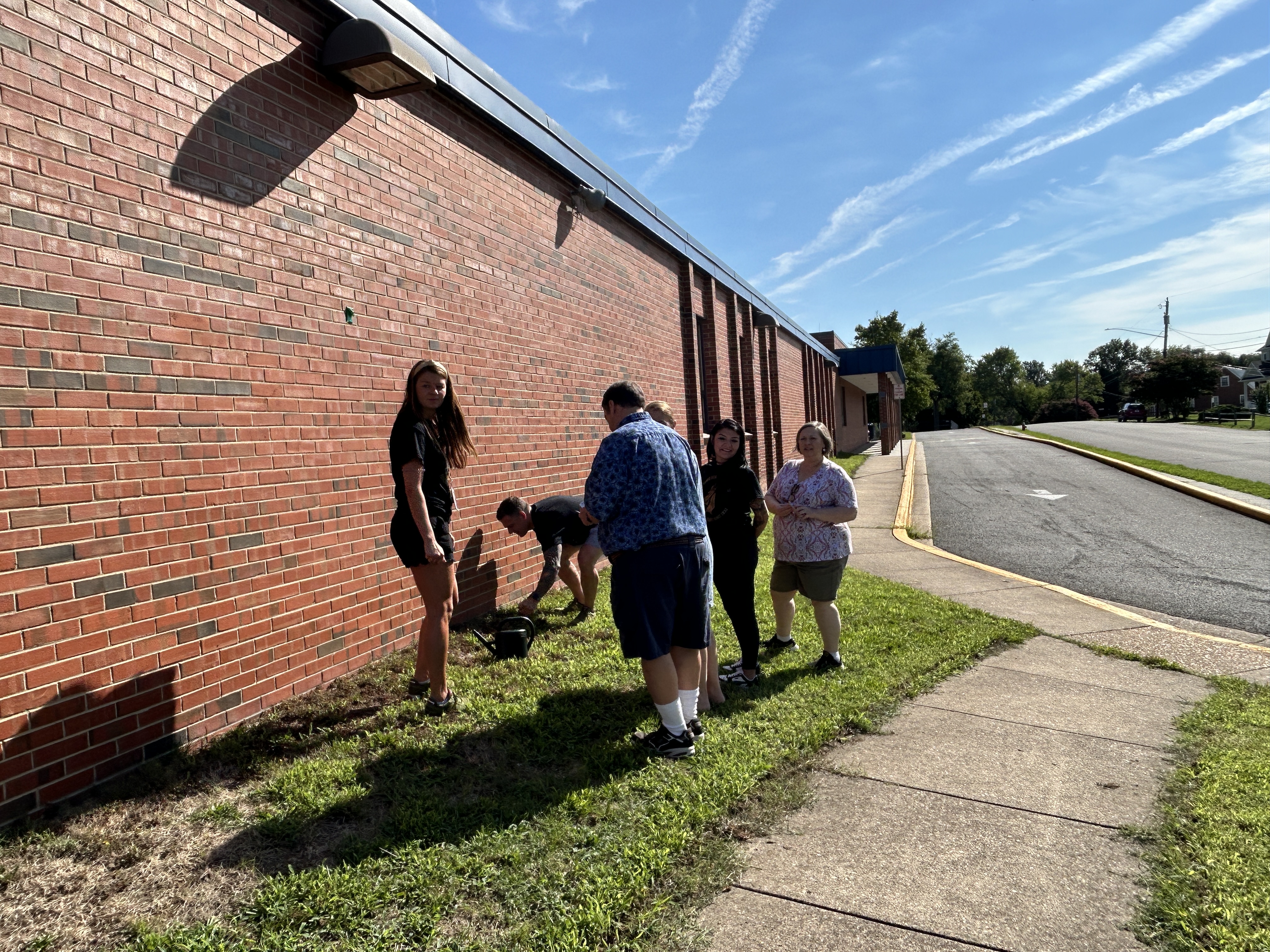 Staff planting marigolds